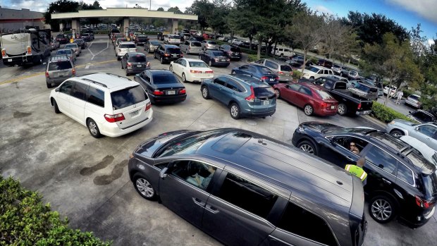 Long lines for petrol in Altamonte Springs, Florida as people prepare for the anticipated strike of Hurricane Matthew.