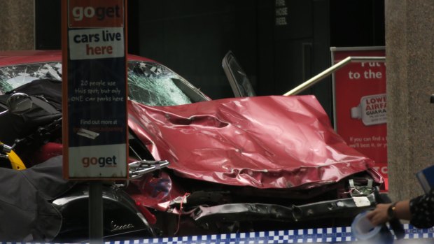 The crumpled car Leigh Henningham when he arrived at the scene in Bourke Street.