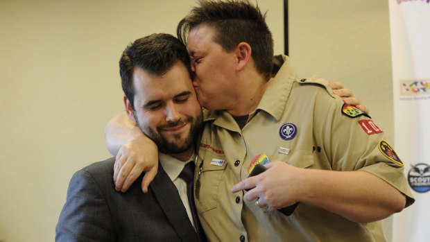 Zach Wahls, executive director of Scouts for Equality, is embraced by Jennifer Tyrrell in 2013. Tyrrell was removed from her position as a den leader in 2012.