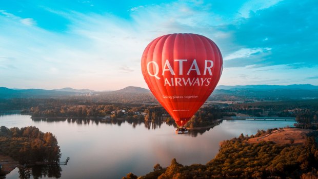 The Qatar Airways balloon, flown by Balloon Aloft Canberra, flies over Canberra.