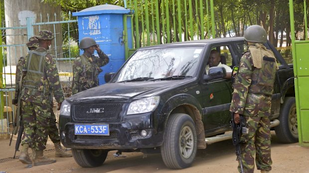 Soldiers guard the main gate of the Garissa University College compound that was the scene of the massacre by al-Shabab gunmen.