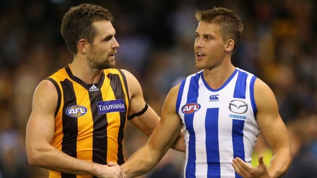 Luke Hodge shakes hands with Andrew Swallow after the game.