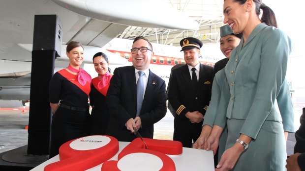 Much to celebrate: Qantas chief executive Alan Joyce helps mark the airline's 95th birthday in Mascot on Monday.