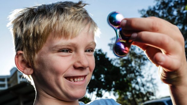 Callum Knight, 7, shows off his spinner.
