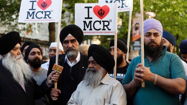 Members of the Manchester Sikh Community attend a vigil in Albert Square, Manchester. 