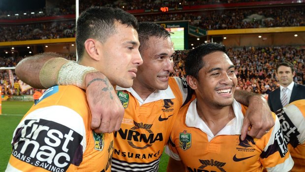 Happy lads: (from left) Jordan Kahu, Justin Hodges and Anthony Milford celebrated after beating the Roosters.