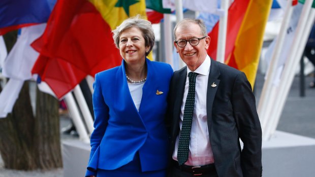 British Prime Minister Theresa May and her husband Philip May arrive to attend a concert at the Elbphilharmonie on the first day of the G20 summit in Hamburg.