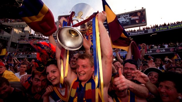 Glory days: Michael Voss celebrates the first premiership in 2001 with fans.