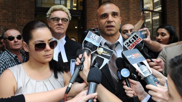 Houda speaks to the press after his successful defence of client Jessica Silva (at left).