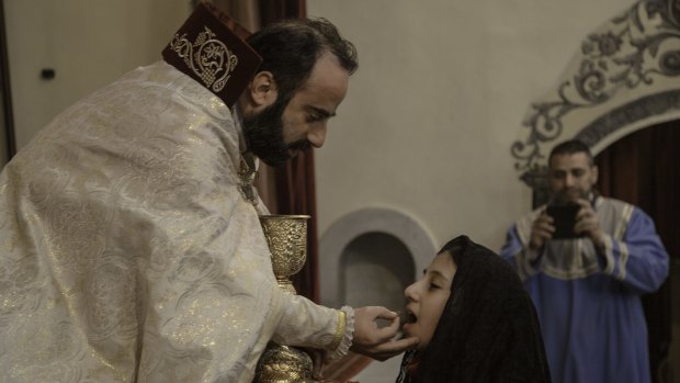 Keeping the faith: Bishop Armash Nalbandian in the Armenian St Sarkis church in Damascus, Syria.