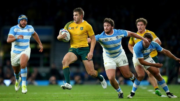 Top athlete: Drew Mitchell breaks into the clear against Argentina in the Rugby World Cup semi-final.