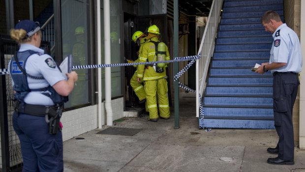 Fire crews and police investigate the alleged arson at the Brierly Street cafe in Weston in March 2014.