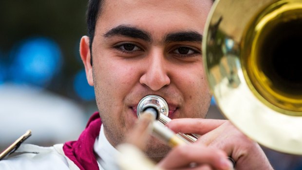 Follow the band: Mikhael Touma, 16, plays the Australian Syrian Youth Marching Band's sole trombone. 