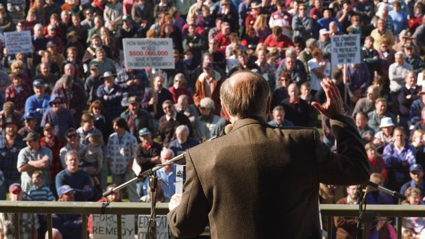 Former Prime Minister John Howard, wearing a bullet-proof vest under his jacket, fronts a rally at Sale at the height of the gun debate in 1996.