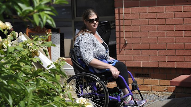 Hazel Passmore is seen leaving her property in Davoren Park, South Australia.