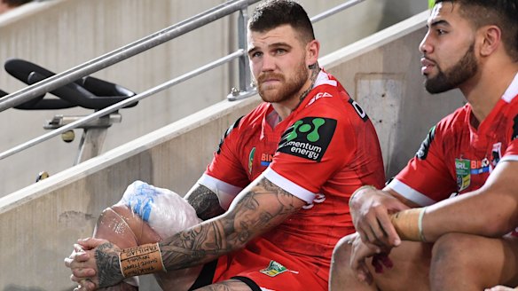 Hobbled: Josh Dugan looks on after sustaining an injury against the Titans.