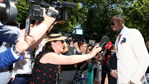 Usain Bolt meets the media during Oaks Day at Flemington.
