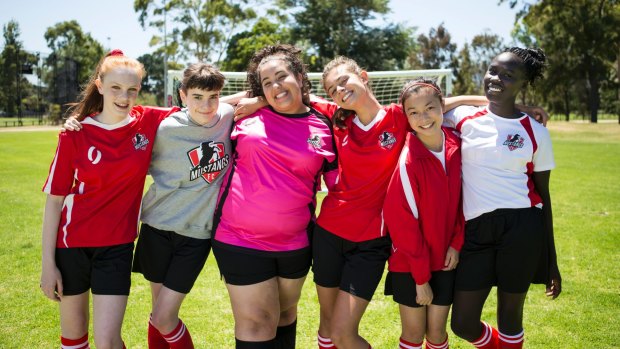 Lara (Monique Heath), Bella (Molly Broadstock), Liv (Ashleigh Marshall), Marnie (Emmanuelle Mattana), Anusha (Gemma Chua Tran), and Ruby (Celine Ajobong) in Mustangs FC.