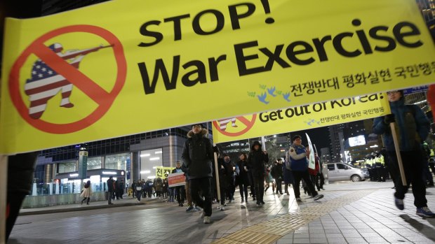 Protesters march toward the US embassy in Seoul during a rally opposing joint South Korea-US military exercises.