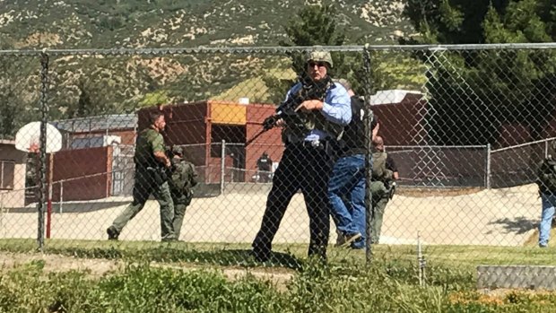 Emergency personnel respond to a shooting inside North Park School Elementary School.