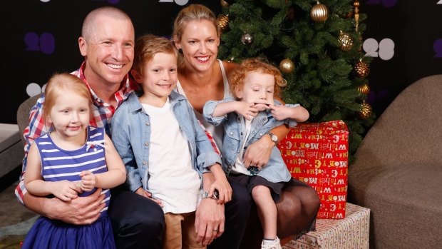 Family man: Brad and Karina Haddin pose for a photo with their children Mia, Zac and Hugo last year.