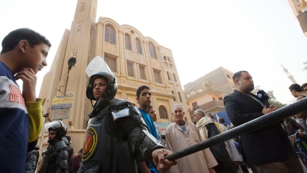 Policemen surround Mar Mina church, in Helwan, Cairo, Egypt where at least 11 people, including eight Coptic Christians, have been killed.