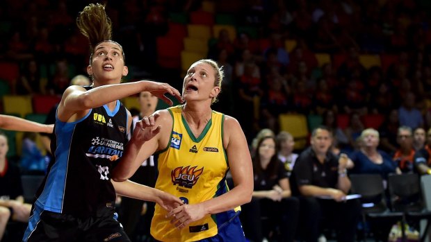 Canberra Capitals skipper Marianna Tolo (left) and Townsville Fire captain Suzy Batkovic battle it out in the WNBL. 