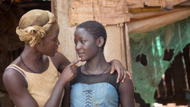 Lupita Nyong'o, left, and Madina Nalwanga appear in a scene from <i>Queen of Katwe</i>. 