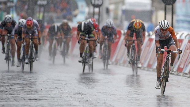 Rabo Liv's Dutch rider Anna van der Breggen holds of the pack to win the La Course By Le Tour De France Women's race on a wet Champs-Elysees yesterday.