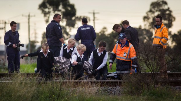 The two men hit by a train in Melbourne's west overnight weren't stealing wire or graffitiing and they weren't murdered either, police say.. 