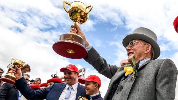Icon: Almandin owner Lloyd Williams holds the Melbourne Cup aloft last year.