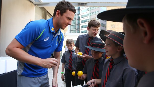 Josh Hazlewood signs autographs for students from St Joseph's College during the launch of the Australia New Zealand Test Series on Tuesday in Brisbane. 
