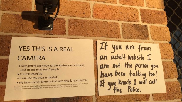 Signs and security put up by Robyn Night and her husband River in response to dozens of visits from men expecting sex.