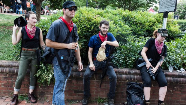 A group of Antifa activists rest during a rally in Charlottesville, Virginia. 