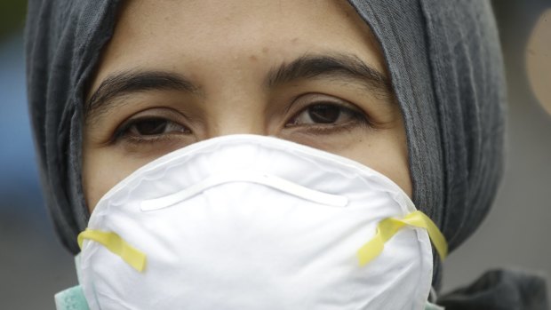 An Indonesian activist wears a mask during a protest demanding the government take quick action to suppress the haze from wildfires in Sumatra and Borneo.