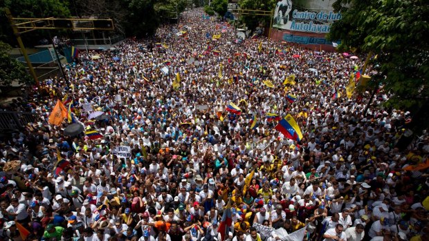 Demonstrators take part in the "taking of Caracas" march.