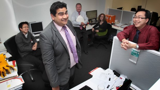 Jayasinha in 2012 with colleagues at his former "day job" at an accountancy firm in South Melbourne.