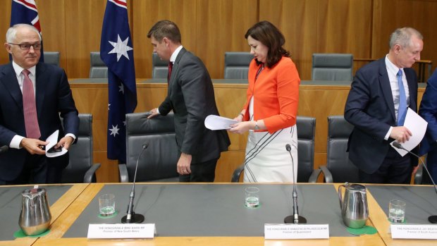 South Australian Premier Jay Weatherill walks away from Prime Minister Malcolm Turnbull after the COAG press conference at Parliament House,