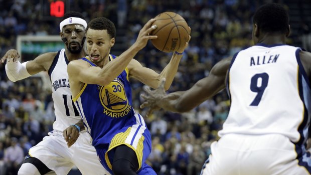 On the move: Golden State Warriors guard Stephen Curry slides between Memphis Grizzlies guards Mike Conley and Tony Allen.