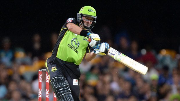 On the tonk: Mike Hussey lashes out during the Big Bash League match between the Brisbane Heat and the Sydney Thunder at The Gabba.
