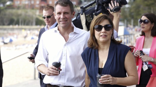 Re-elected: Premier Mike Baird and his wife Kerryn in Manly on Sunday.