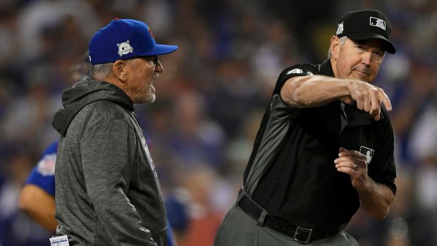 Marching orders: Chicago Cubs manager Joe Maddon, left, is thrown out of the game by umpire Mike Winters.