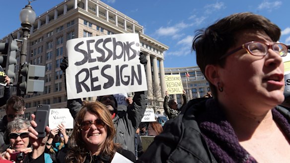 Protesters gather outside the Justice Department in Washington.