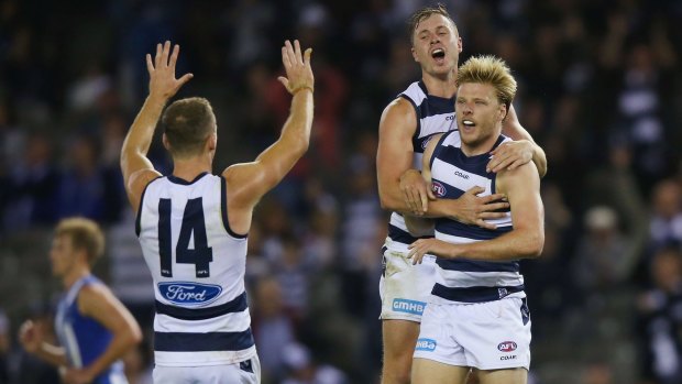 Left it late: George Horlin-Smith, Joel Selwood and Mitch Duncan celebrate the winning goal.