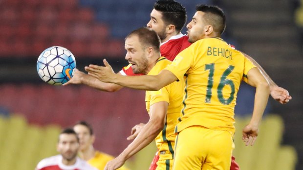 Hard man to beat: Matt Jurman (centre) has become a key player in the Socceroos' defence.