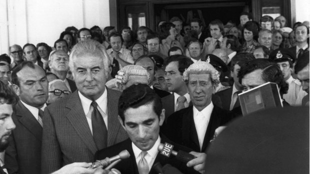 Gough Whitlam listens to David Smith read the proclamation dissolving Parliament.