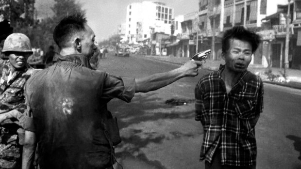 A South Vietnamese general executes a Viet Cong officer with a single pistol shot in Saigon in 1968.