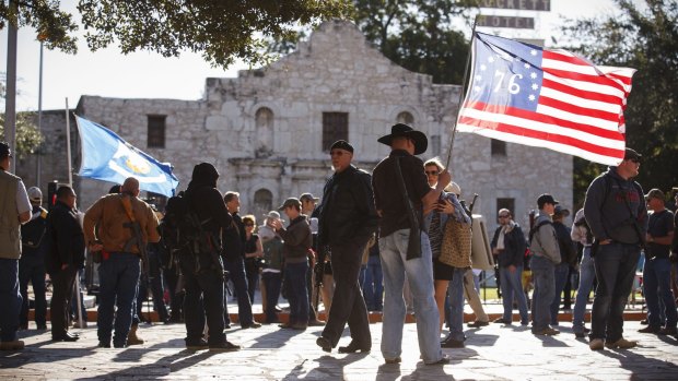 What's in a name? Demonstrators, some with rifles, gather for a pro-gun rally at the Alamo in San Antonio.