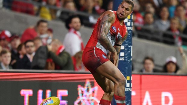 Luck favours the brilliant: Lance Franklin looks around after the ball bounces off his foot for a goal.