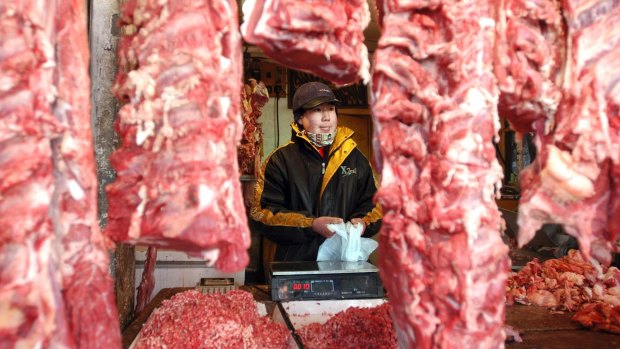 A Chinese shopkeeper in Beijing. China has opened its borders to US beef producers in a deal the Trump administration hailed as a significant step in their efforts to boost US exports to the world's second-largest economy.
